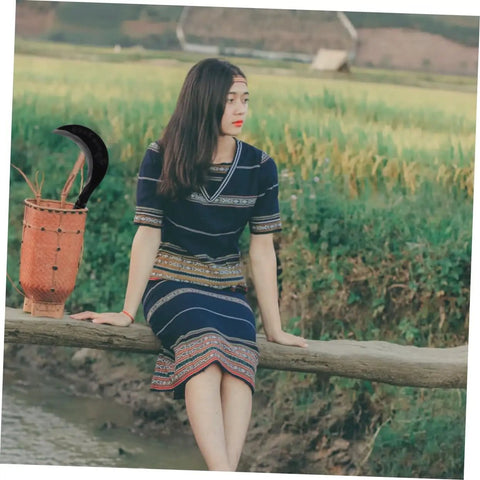 Long Handle Hand Scythe For Weed Removal And Grass Control Manganese Steel Weeding Tool in rustic setting with woman.