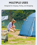 Person using 8 Ft Adjustable Ratchet Tie Downs 4 Pack With Quick Lock Pulley System to secure a blue tent at campsite