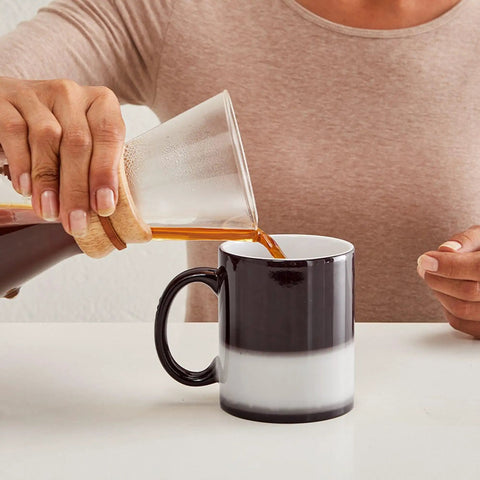 Fresh Golf Cart Magic Mug For Real Golfers Heat Changing Ceramic Coffee Cup 11 Oz being filled with coffee by a hand.
