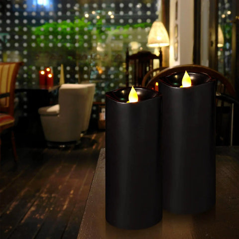 Flameless LED Candles With Remote Timers And Moving Flame Effect, 7-Inch Pillars By 3-Inch Diameter, Battery Operated, Black, Set Of 2 in cozy setting