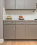 Modern kitchen with light grey cabinets featuring 30 Pack Slim 5 Inch Center To Center Square Bar Cabinet Handles Brushed Nickel Kitchen Drawer Pulls