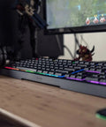 Badass Gaming Keyboard Featuring Mechanical Membrane Keys Dope RGB Lighting Smooth As Silk Typing And Killer Tactile Click Feel on desk