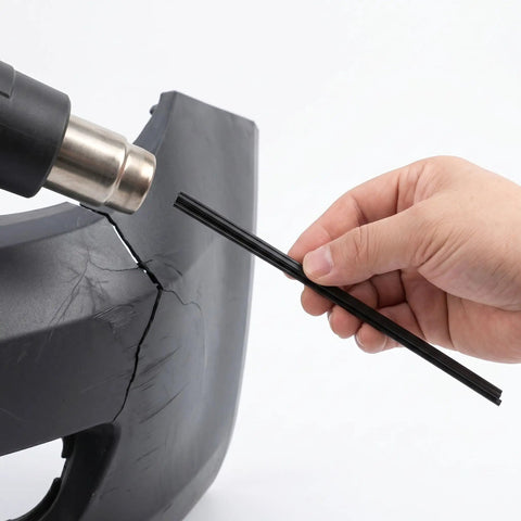Black Plastic Welding Rods Set 100 Pcs Pro Grade Polypropylene 7.87 Inch Flexible and Durable for Car Bumpers and Kayak Repairs Easy DIY Weld Kit with Nearly Invisible Seam Finish, hand holding rod on bumper crack