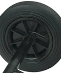 Close-up of 5-inch wheel of Model 32 Transporter For RIDGID 300 Pipe Threading Machine And Power Drive Heavy Duty Rubber Tired Cart.