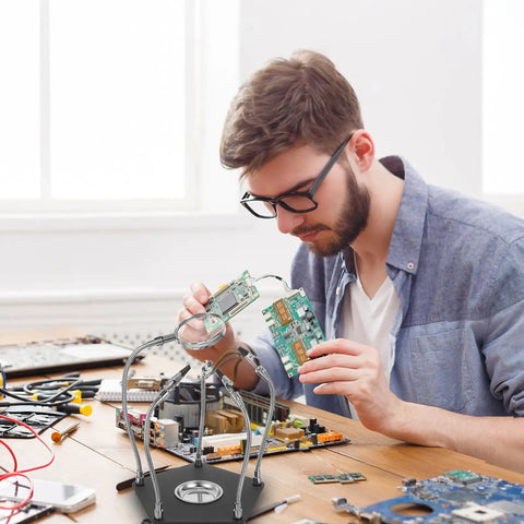 Man using Adjustable Soldering Support Tool With Universal Clamp And Helping Hands, Pro Grade Soldering Station Kit for PCB work