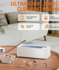 Quick Grab 50 Khz Ultrasonic Cleaner With Three Timer Settings For Bling Glasses Watches Dentures And Razors To Keep Your Daily Carry Fresh Without Any Drama Or Excess Mess Around Your Sink Area on a wooden table.