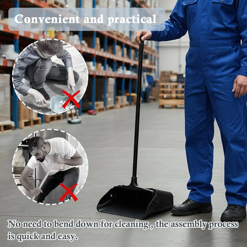 Heavy Duty Upright Standing Dustpan Built Different Tight Pivoting Base used in a warehouse, with ergonomic long handle for ease of use.