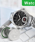 SR621SW Watch Battery 10 Pack Ag1 364 363 Alkaline Coin Button Cell Lr621 next to a stylish silver watch on a desk.