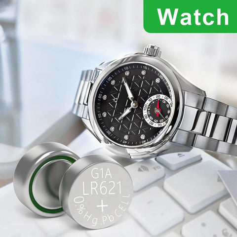 SR621SW Watch Battery 10 Pack Ag1 364 363 Alkaline Coin Button Cell Lr621 next to a stylish silver watch on a desk.