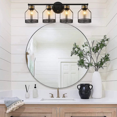Industrial Farmhouse 4 Light Vanity Sconce With Vintage Edison Bulbs Black Metal Cage Shade mounted above bathroom vanity mirror