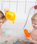 Two children playing with toys in a bathtub