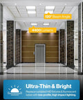4 Pack 2x2 LED Flat Panel Light 5000K Daylight, 40W Dimmable 0 to 10V illuminating a modern building corridor