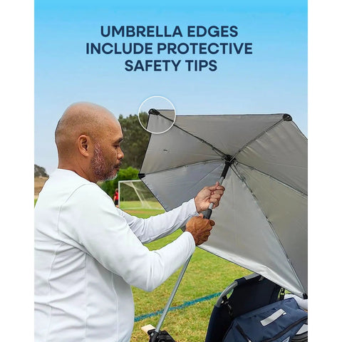 Man adjusting Versa Brella Midnight Blue Outdoor Shade Umbrella With Heavy Duty Clamp during outdoor activity.