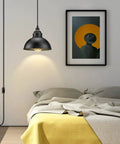 Premium Plug In Pendant Light With Fifteen Foot Drop Cord and Smooth Switch above a bed with cozy yellow and gray bedding.