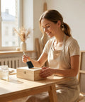 Woman using Super Smooth Poly Foam Paint Brushes With Ergonomic Handles For Effortless Application And Flawless Finish on a wooden box.