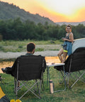 Oversized XL Camping Chair For Adults Built Tough 500 Lb Capacity with padded headrest and cup holder at campsite during sunset