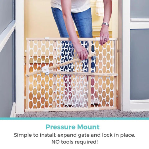 Person installing Wooden Baby Gate With Mesh For Doorways, Quick Fit Pressure Mounted, Adjustable From 26.5 To 42 Inches Wide