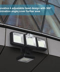 Solar Outdoor Motion Sensor Flood Light With Remote Control mounted on building exterior with four adjustable LED heads