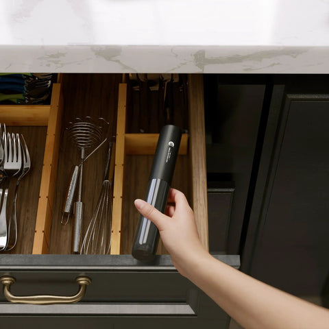 Person placing Usb Rechargeable Milk Frother Handheld 2 In 1 Dual Spring Whisk Electric Frother Wand in kitchen drawer