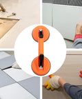 Heavy Duty Double Suction Cup Vacuum Glass Lifter With Tough ABS Rubber Build for smooth slab handling, shown in use during tile installation.