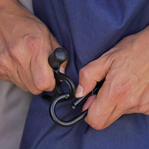 Person securing tarp with Heavy Duty Adjustable Bungee Cords With Hook And Carabiner, 48 Inch Unstretched, 7-70 Inch Stretch.