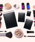 Black Bubble Mailers 8.5x12 Inches 25 Pack Padded Shipping Envelopes With Ultra Strong Adhesive shown with makeup items