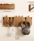 Premium Acacia Wood Wall Mounted Coat Rack With Eight Retractable Hooks, Space Saving Flip Down Entryway Stand, Zero Drama Install And Heavy Duty Grip For The Daily Grind on wall with kettlebell and key.