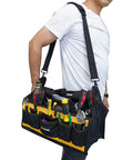 Person carrying 17 Inch Open Top Electrician Tool Bag With Shoulder Strap HVAC Pro Carrier Center Plastic Tray 30 Pockets