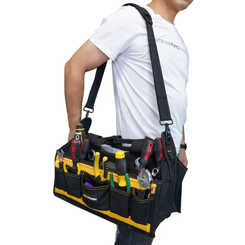 Person carrying 17 Inch Open Top Electrician Tool Bag With Shoulder Strap HVAC Pro Carrier Center Plastic Tray 30 Pockets