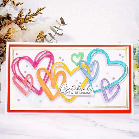 Colorful heart shapes card front with 'Celebrate New Beginnings' text, created using Love Hearts Metal Die Cuts Frame Set 4 Pieces Silver Embossing Dies for Scrapbooking