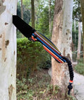 Knife with pearl resin handle slabs, DIY knifemaking, polymer scale grips, outdoors against tree