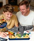 Father and son assembling the Beefy Mechanical Shark Build Kit With 1031 Pieces For Adults And Teens, showing gear system features.