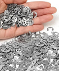Hand holding stainless steel E clips from 120 Piece Shaft External Retaining Ring E Clips Kit 1.5mm To 10mm Stainless Steel Snap Circlips Washer
