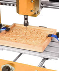 CNC machine with wood carving, secured by Hold Down Clamp Kit for CNC Routers and Woodworking, No Slip Grippy T Track Clamps 23x30mm Fit, 2 Pack Blue