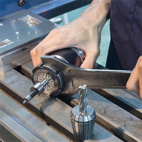 Heavy Duty ER40 Spring Collet Chuck For CNC Lathe Milling Machines 4mm-25mm Range being tightened with tool, showing grip detail.