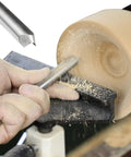 No Nonsense Heavy Duty 5/8 Inch HSS Bowl Gouge With Sturdy Beech Handle For Wood Lathe Turning cutting through wood with shavings flying.