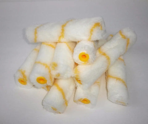 Kickass 200 Pack of Mini Paint Rollers 4 Inch by 11mm Solvent Resistant Foam Bubbles Rollers stacked for epoxy resin projects.