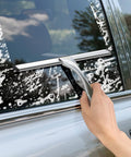 10-inch stainless steel all-purpose squeegee with two adhesive hooks, used on car window