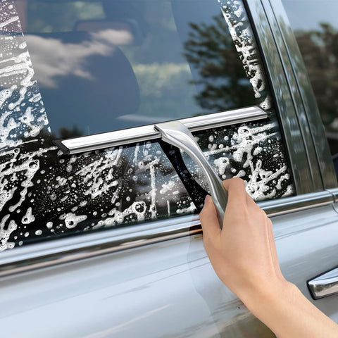 10-inch stainless steel all-purpose squeegee with two adhesive hooks, used on car window