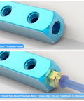 Close-up of blue five way eight port pneumatic manifold block aluminum air distribution block for compressed air systems one quarter inch