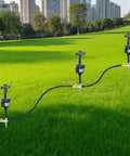 Three motion activated lawn sprinkler deterrents for cats, dogs, and birds with 360 degree adjustable head in green field