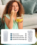 Countertop nugget ice maker Silonn in black, lifestyle shot of a woman enjoying a drink.