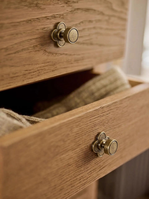 Top Shelf Antique Brass Cabinet Knobs With Quatrefoil Backplate on wooden drawer, vintage style, six pack.