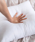 Hand pressing on Pack Of 4 Outdoor Pillow Inserts Waterproof 18x18 Inch Square Cushions For Patio Garden Bed Sofa Couch Cozy Plush Inner Fill No Covers Included Great For Patio Or Garden Decor Weatherproof All Season Comfort.
