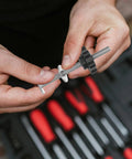 Person assembling Four Star Shaped T Track Knobs With Stainless Bolts And Washers, Ergonomic Grippy Hand Knobs For Woodworking Fixtures And Jigs.