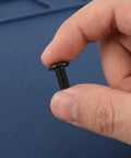 Close-up of hand holding 40 Piece Drive Socket Cap Bolt Furniture Connector Set with M3 countersunk screws and barrel nuts