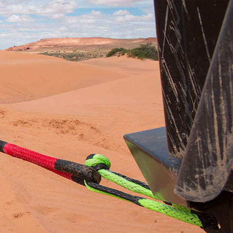 Heavy Duty Synthetic Soft Shackle With Gator Jaw Pro towing a vehicle in desert terrain