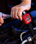 Close-up of Three Eighths Inch Digital Torque Adapter With Audible Buzzer And LED Flash, 5.9 to 59 Ft-Lbs Range in use on engine