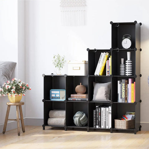 12-Cube Black Storage Organizer Shelf System For Bedroom, Office, And Living Room with books and decor, modular DIY plastic closet shelves.