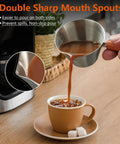 Pouring coffee from Barista-Grade Stainless Steel Espresso Shot Cup With Handle, V-Shaped Spouts Measuring Cup, 3.4 oz 100 ml into mug